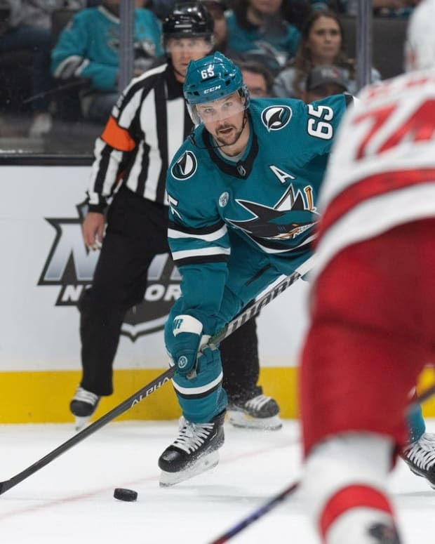 Oct 14, 2022; San Jose, California, USA; San Jose Sharks defenseman Erik Karlsson (65) looks to pass the puck during the second period against the Carolina Hurricanes at SAP Center at San Jose. Mandatory Credit: Stan Szeto-USA TODAY Sports